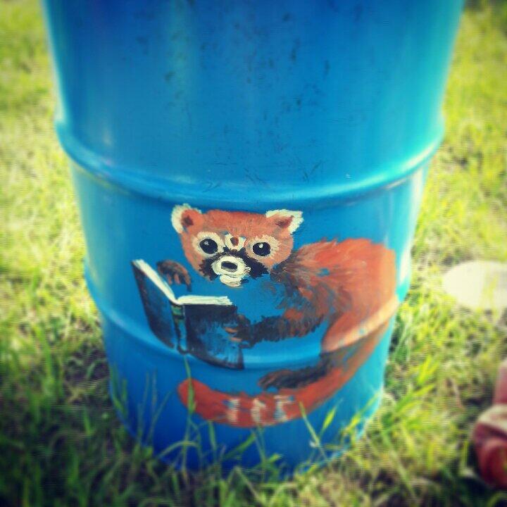 glastonbury charity bins 2014 red panda reading a book

